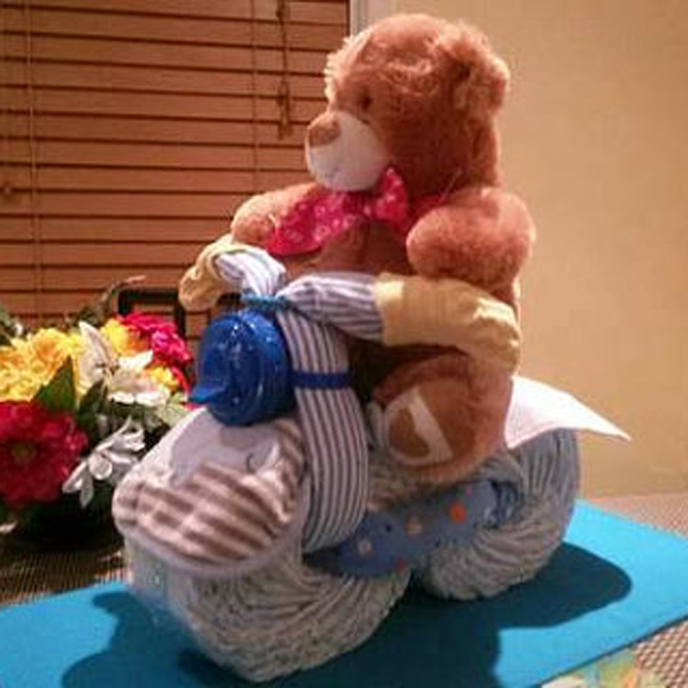 Bicycle Diaper Cake. Neutral baby shower centerpiece. Almost any plush toy as a biker